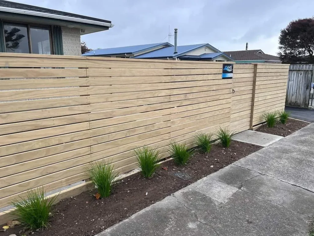 Privacy fence Kapiti with horizontal slat design - contemporary coastal resistant timber fencing